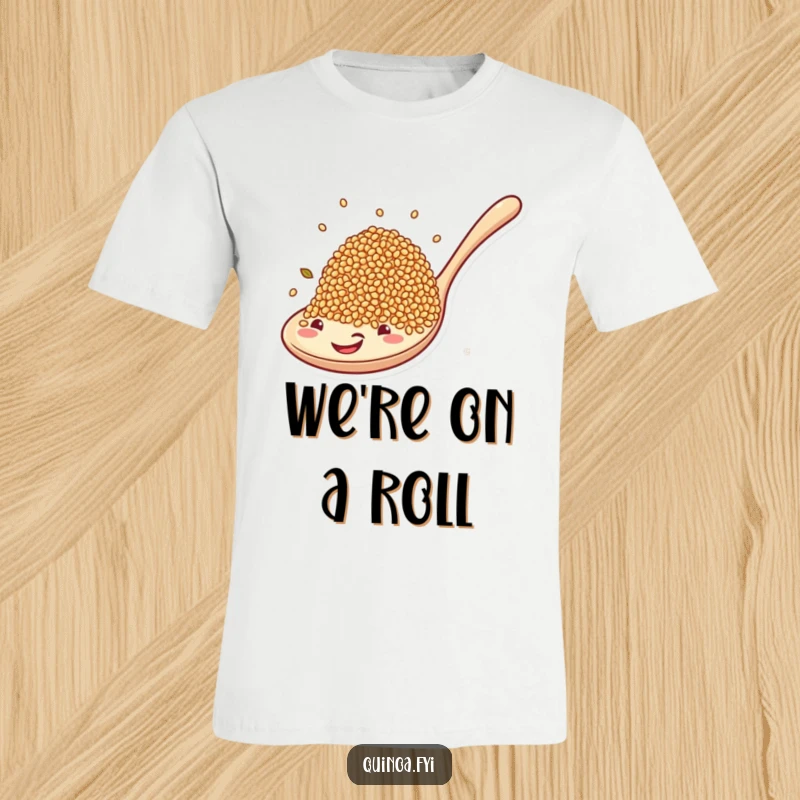 Funny t-shirt depicting quinoa grains excitedly riding a large, happy spoon, celebrating healthy food with humor.