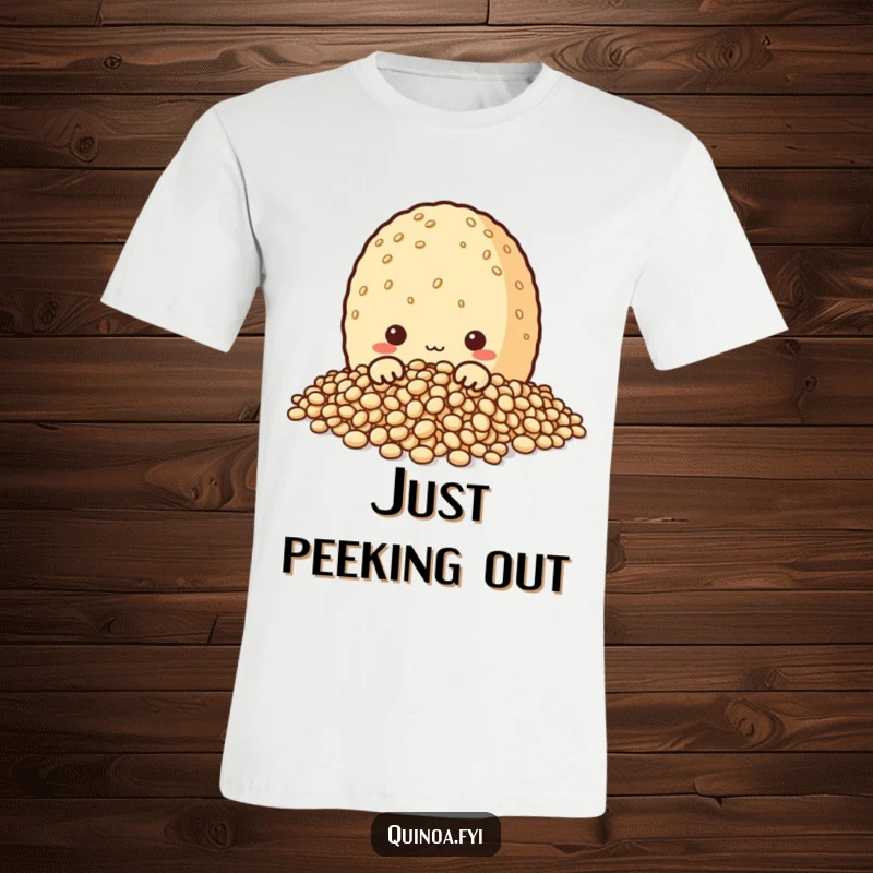 Funny t-shirt with a charming quinoa grain character playfully peeking out from a heap of its own grains, ideal for the inquisitive wearer.